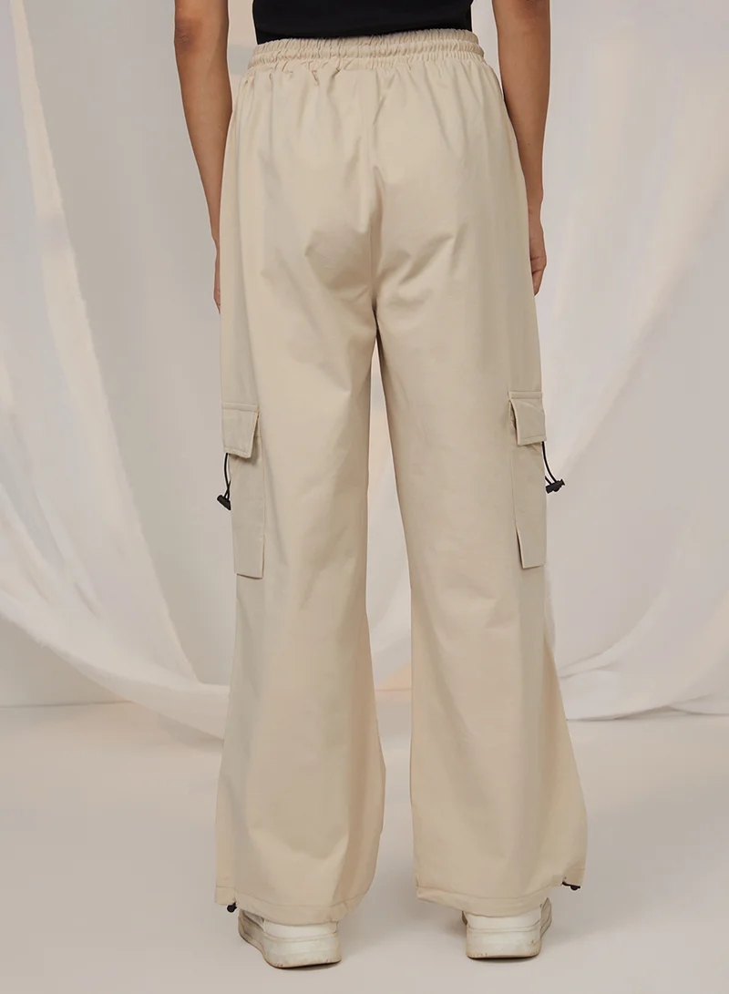 Pinacolada  Women's Beige Solid Cargo Parachute Trousers For Casual Wear | Mid-Rise | 4 Pockets | Drawstring Closure | Cargo Pants Designed With Comfortable Fit For Woman & Girls for Women | Best Price UAE